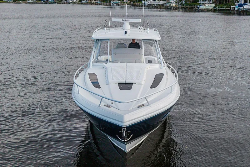 Slide: The Image of 2024 Intrepid 41 Valor boat on calm water, front view. - 4