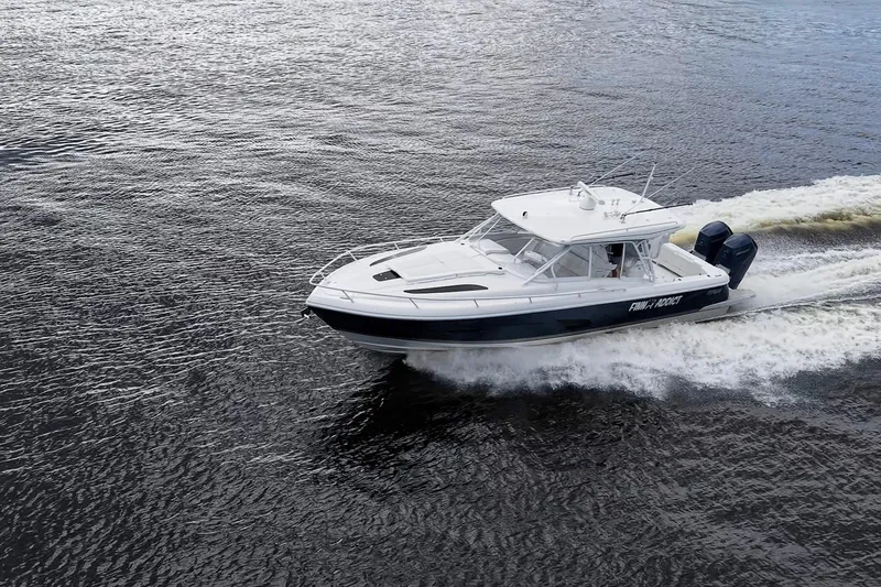 Slide: The Image of 2024 Intrepid 41 Valor cruising on open water, showcasing sleek design and powerful engines. - 43