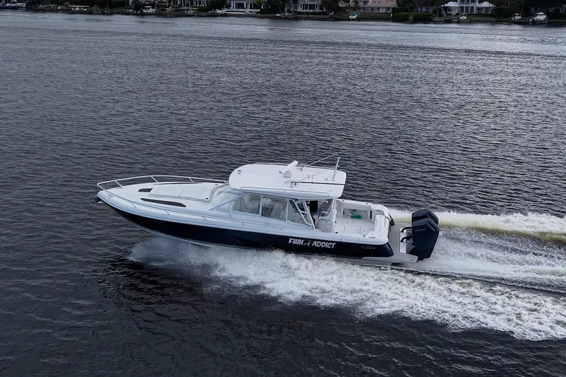 Slide: The Image of 2024 Intrepid 41 Valor cruising on water, showcasing sleek design and powerful performance. - 44