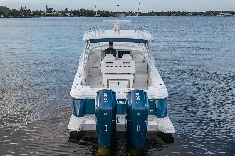 Slide: The Image of 2024 Intrepid 41 Valor boat with dual 600 V12 engines on calm water. - 9