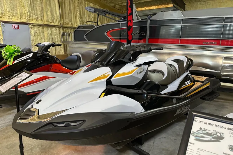 The Image of 2026 Kawasaki ULTRA 160LX jet ski displayed in a showroom. - 0