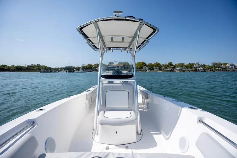 Slide: The Image of 2020 Sea Fox 206 Commander boat on calm water under clear blue sky. - 10