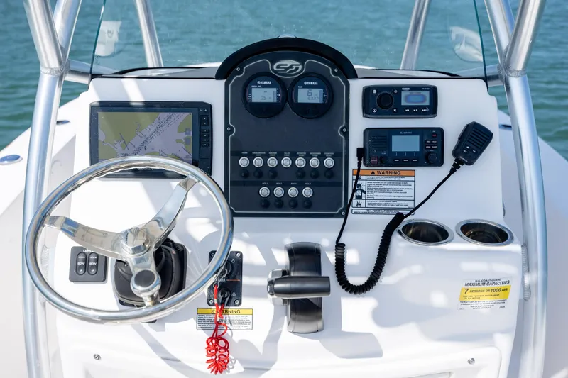 Slide: The Image of Control panel of a 2020 Sea Fox 206 Commander boat with navigation and communication equipment. - 14