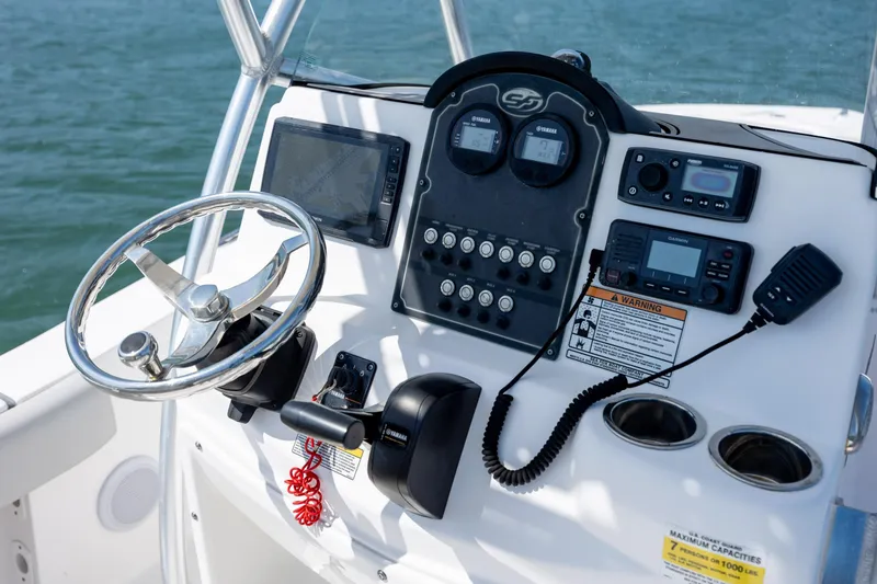 Slide: The Image of Control panel of a 2020 Sea Fox 206 Commander boat with steering wheel and navigation instruments. - 15