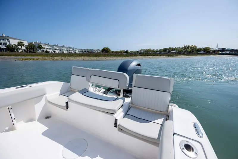 Slide: The Image of 2020 Sea Fox 206 Commander boat with seating, on calm water near shoreline. - 16