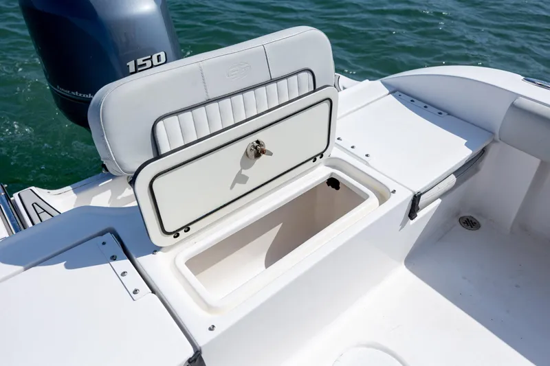 Slide: The Image of 2020 Sea Fox 206 Commander boat with open storage compartment and visible engine. - 17