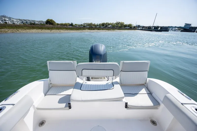 Slide: The Image of 2020 Sea Fox 206 Commander boat interior with seating, on calm water. - 18