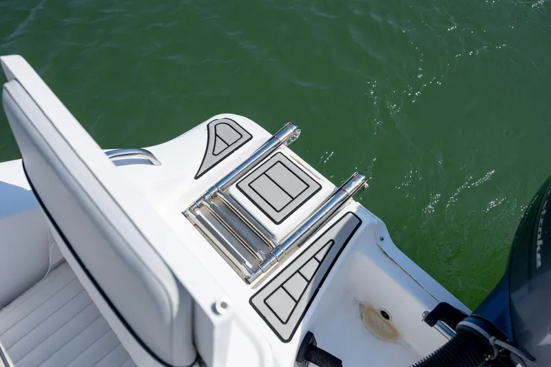 Slide: The Image of 2020 Sea Fox 206 Commander boat ladder and platform on water. - 20