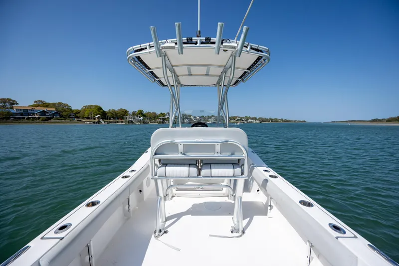 Slide: The Image of 2020 Sea Fox 206 Commander boat on calm water under clear blue sky. - 22