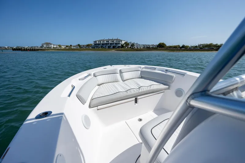 Slide: The Image of 2020 Sea Fox 206 Commander boat on calm water near coastal buildings. - 7