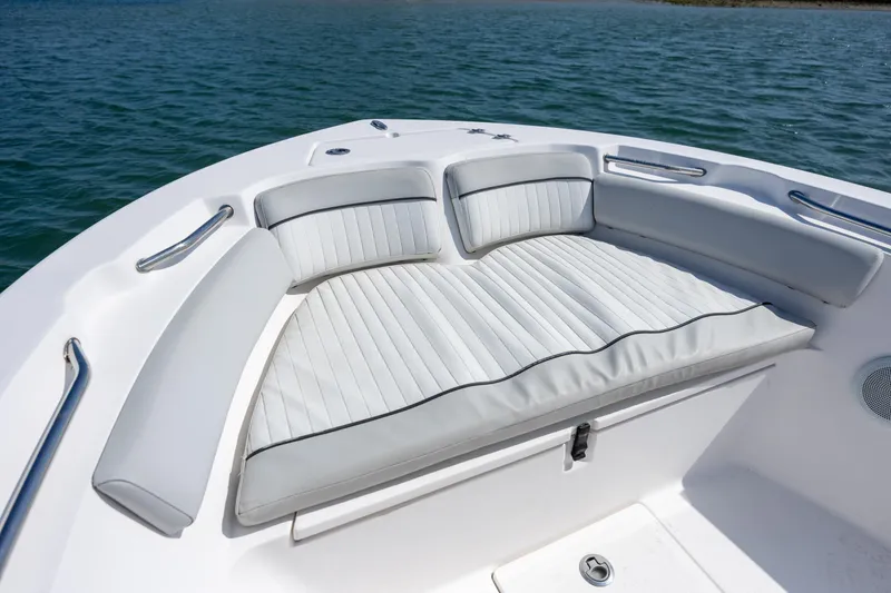 Slide: The Image of 2020 Sea Fox 206 Commander boat with cushioned seating on calm water. - 8