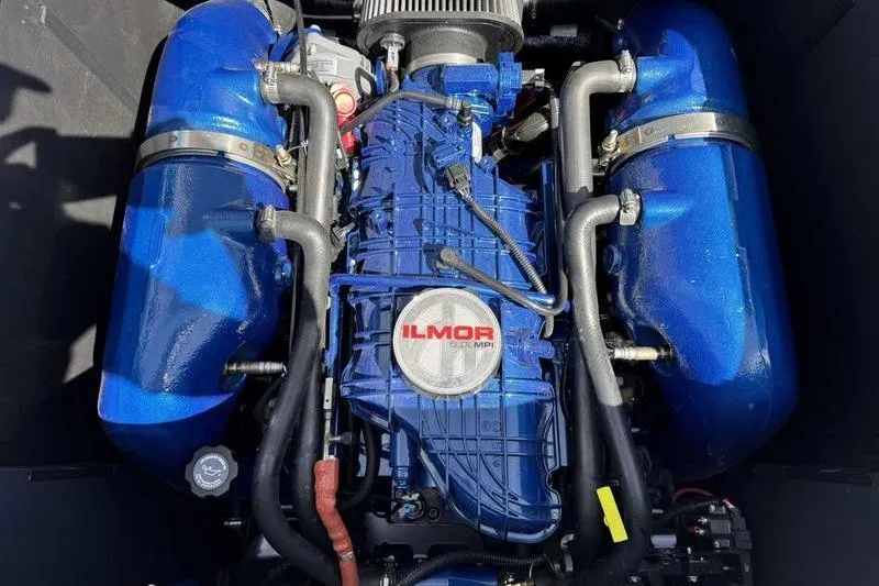 Slide: The Image of 2022 MasterCraft XT22 engine, featuring a powerful Ilmor design with blue components. - 9