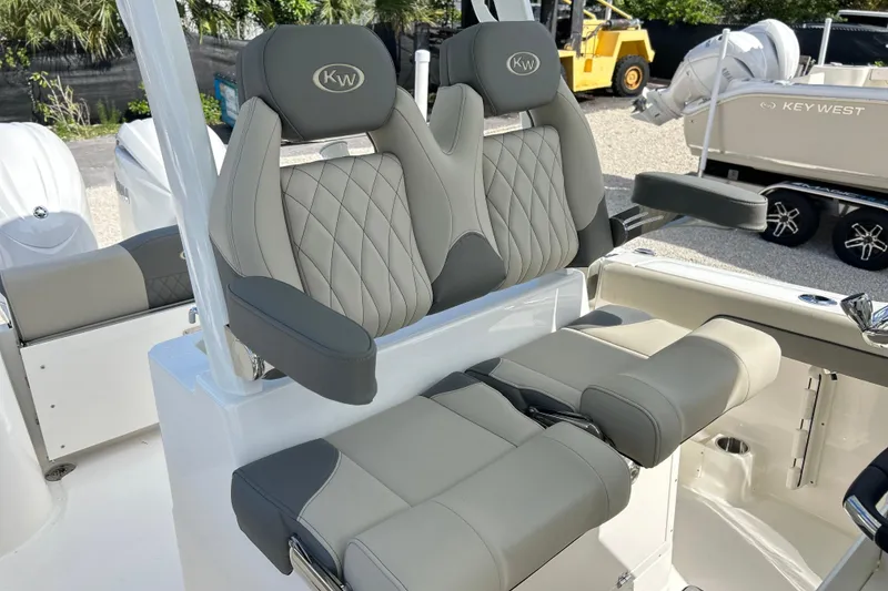 Slide: The Image of 2026 Key West 260 Center Console boat with luxurious seating and modern design. - 11