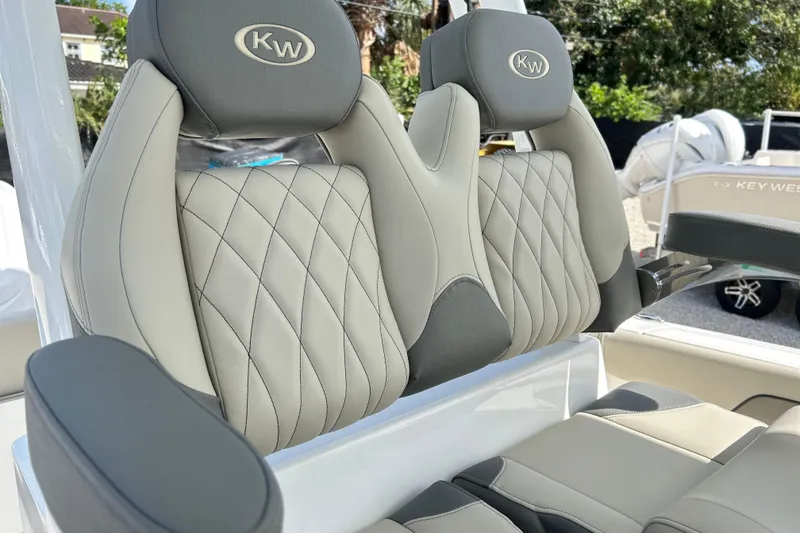 Slide: The Image of 2026 Key West 260 Center Console boat seats with diamond stitching and KW logo. - 13