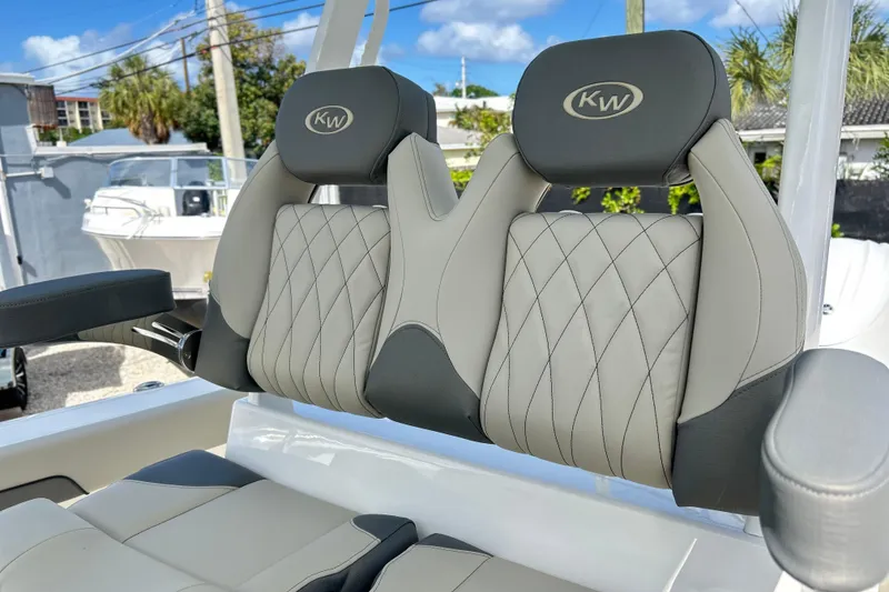 Slide: The Image of 2026 Key West 260 Center Console boat seats with diamond-stitched upholstery and KW logo. - 14