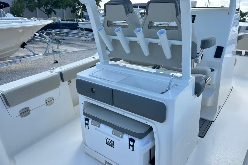 Slide: The Image of 2026 Key West 260 Center Console boat interior with seating and storage features. - 15