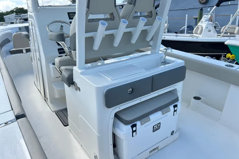 Slide: The Image of 2026 Key West 260 Center Console boat interior with seating and storage features. - 16