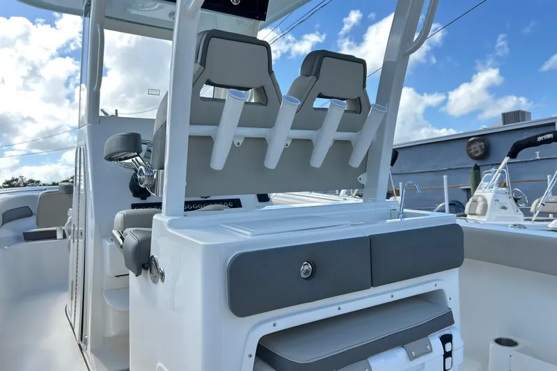 Slide: The Image of 2026 Key West 260 Center Console boat interior with seating and rod holders. - 17