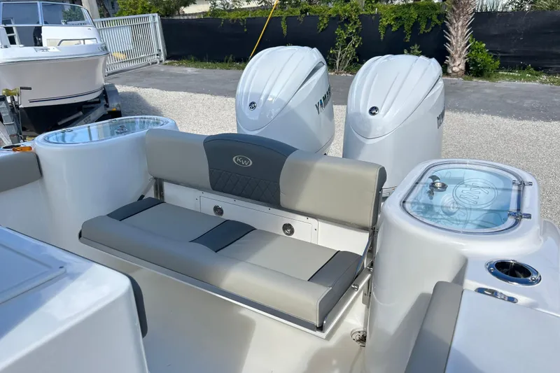 Slide: The Image of 2026 Key West 260 Center Console boat with Yamaha engines and seating area. - 18