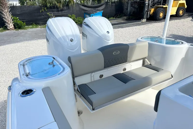Slide: The Image of 2026 Key West 260 Center Console boat with dual engines and comfortable seating. - 19