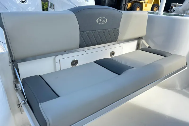 Slide: The Image of 2026 Key West 260 Center Console boat seat with gray upholstery and KW logo. - 20