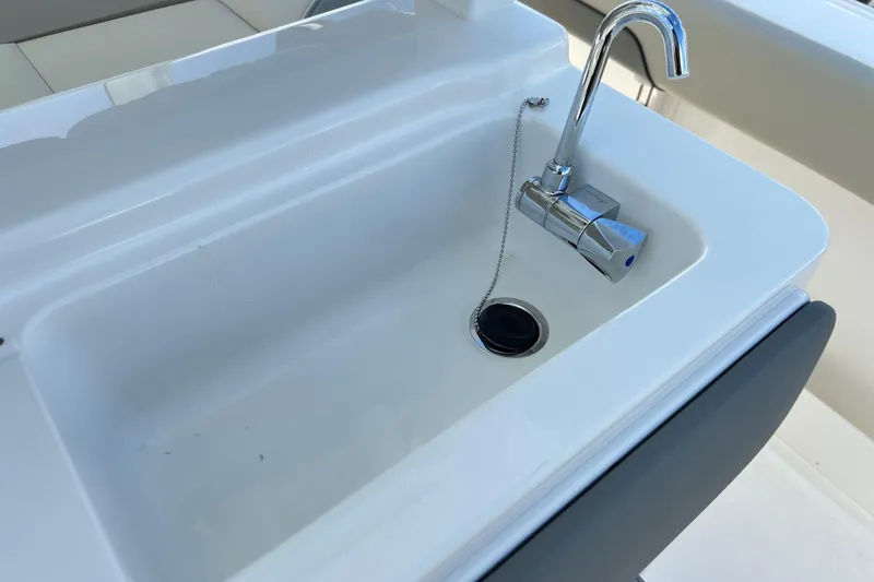 Slide: The Image of Stainless steel sink and faucet on 2026 Key West 260 Center Console boat. - 25