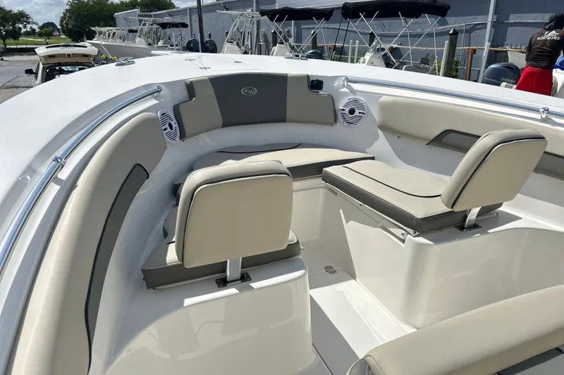 Slide: The Image of 2026 Key West 260 Center Console boat interior with cushioned seating and speakers. - 3