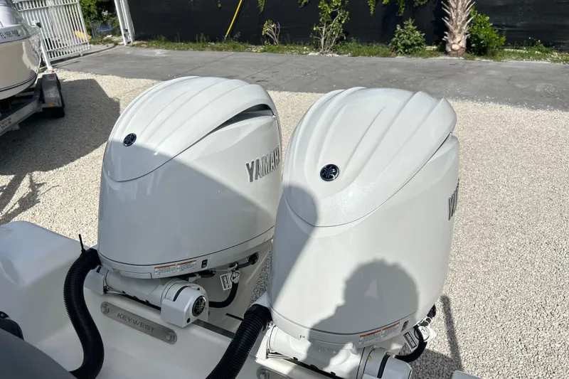 Slide: The Image of Twin Yamaha outboard engines on a 2026 Key West 260 Center Console boat. - 31