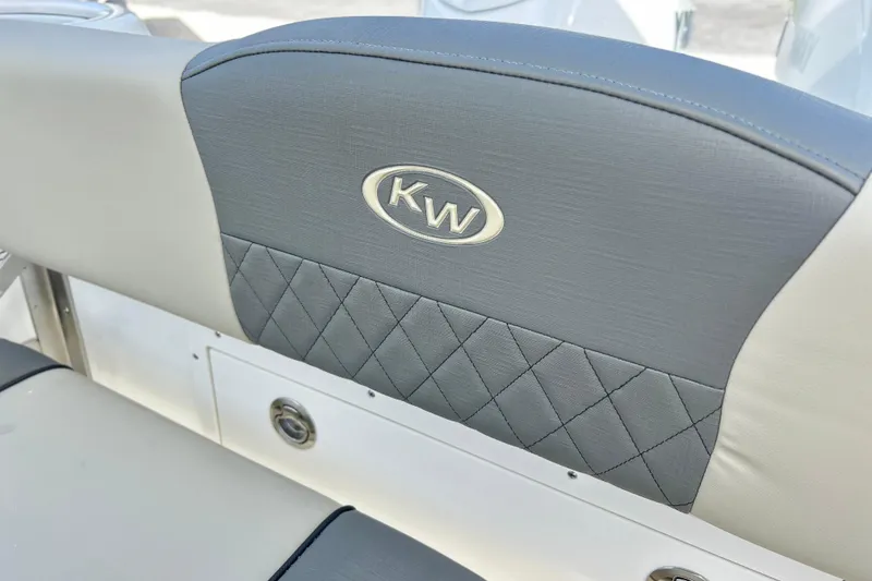 Slide: The Image of 2026 Key West 260 Center Console boat seat with KW logo and quilted design. - 32