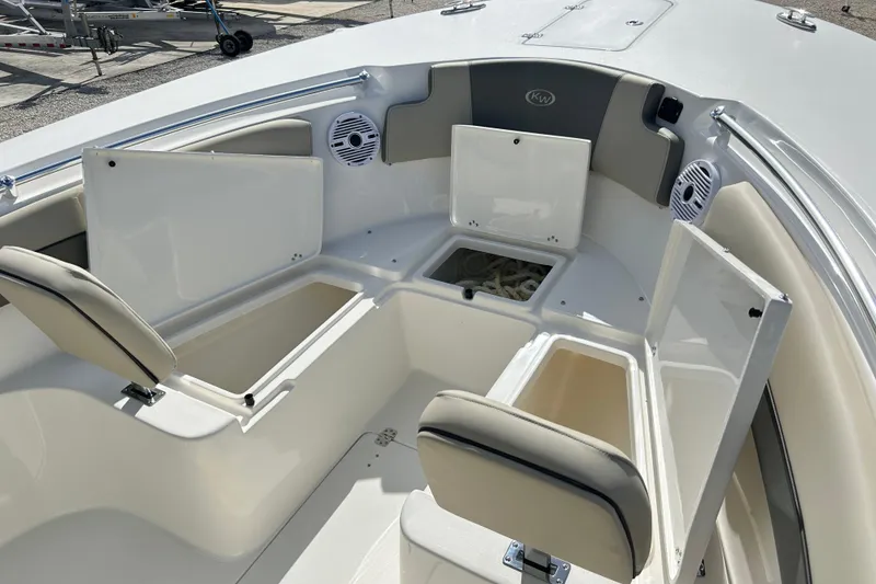 Slide: The Image of 2026 Key West 260 Center Console boat interior with open storage compartments and seating. - 35
