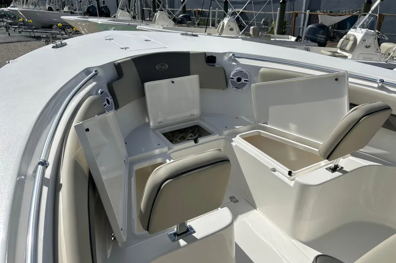 Slide: The Image of 2026 Key West 260 Center Console boat interior with open storage compartments and seating. - 37