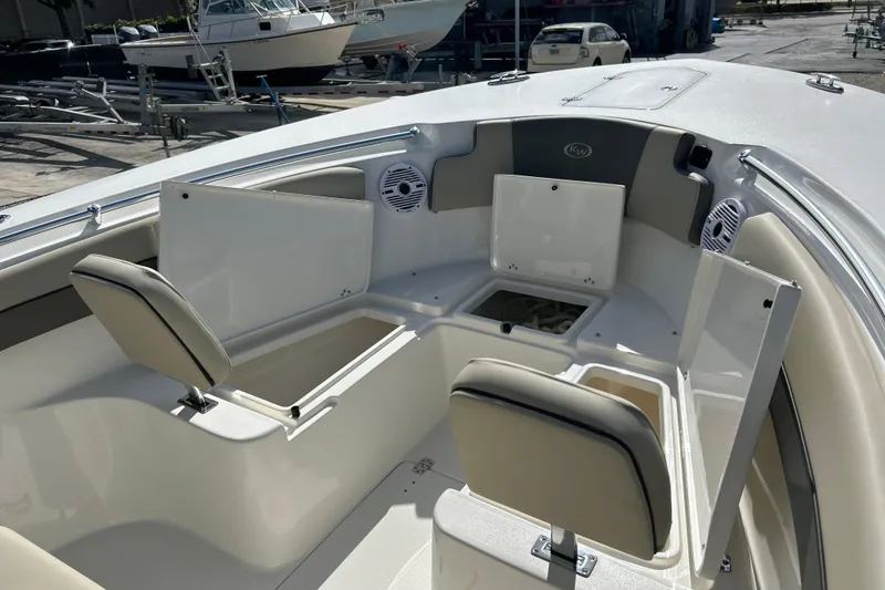 Slide: The Image of 2026 Key West 260 Center Console boat interior with open storage compartments. - 38