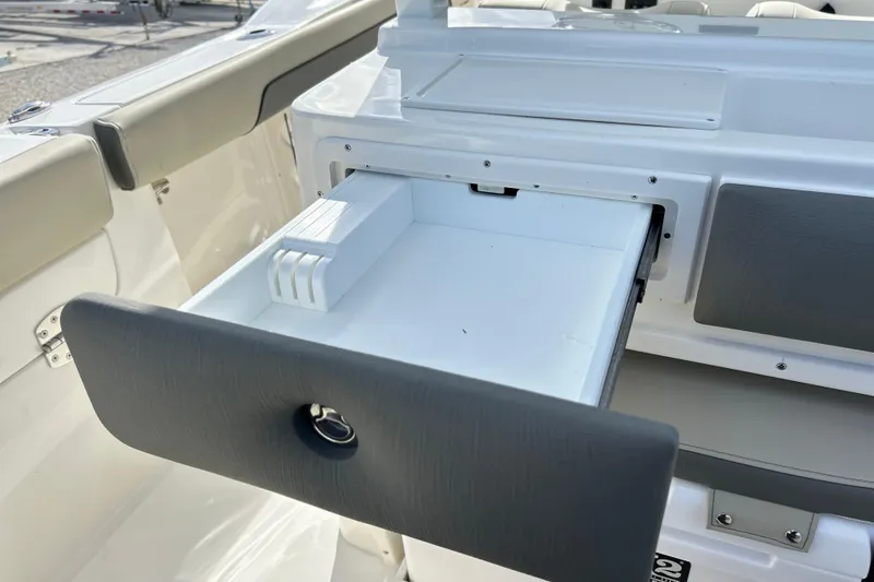 Slide: The Image of Open storage drawer on 2026 Key West 260 Center Console boat. - 39