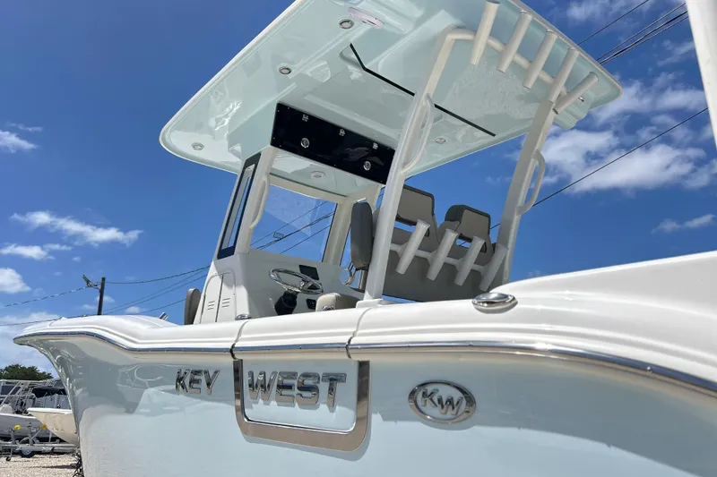 Slide: The Image of 2026 Key West 260 Center Console boat under clear blue sky. - 42