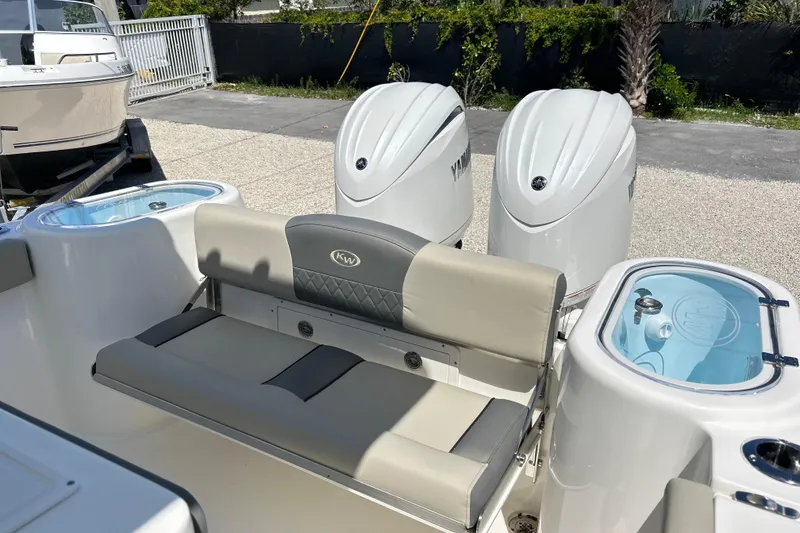 Slide: The Image of 2026 Key West 260 Center Console boat with dual Yamaha engines and seating area. - 44