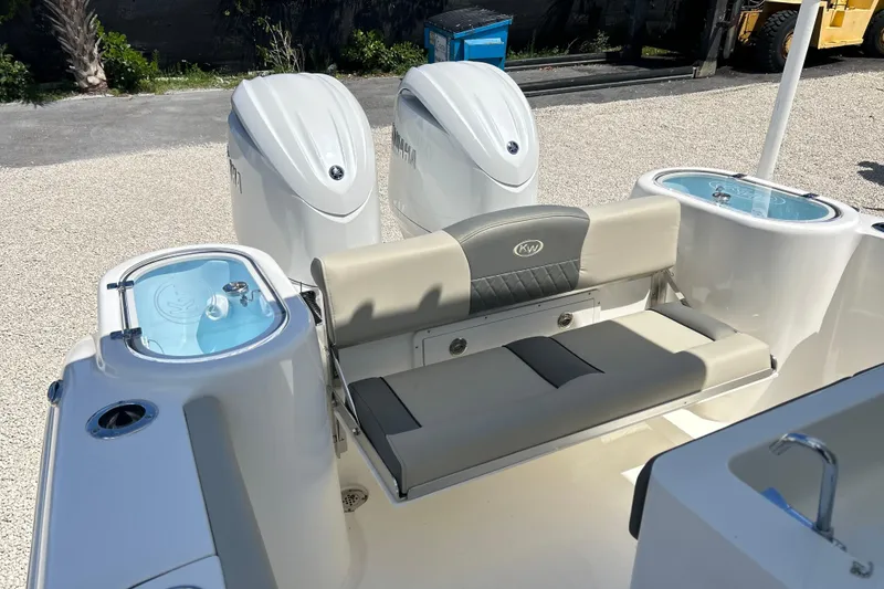 Slide: The Image of 2026 Key West 260 Center Console boat with dual engines and seating area. - 45