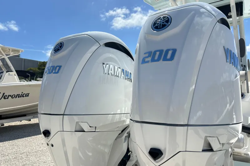 Slide: The Image of Twin Yamaha 200 engines on a 2026 Key West 260 Center Console boat. - 48