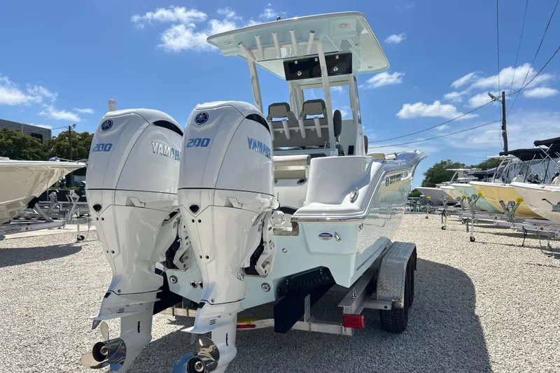 Slide: The Image of 2026 Key West 260 Center Console boat with twin Yamaha 200 engines on a trailer. - 50