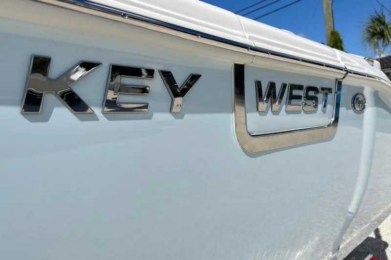 Slide: The Image of 2026 Key West 260 Center Console boat with chrome logo detail. - 52