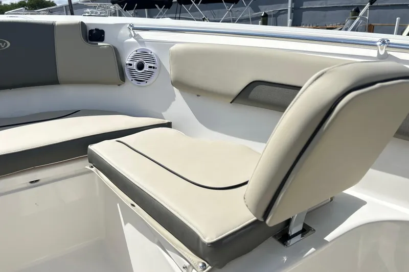 Slide: The Image of Interior seating of 2026 Key West 260 Center Console boat, featuring beige cushions. - 7