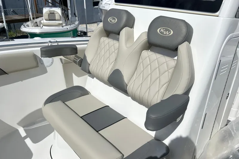 Slide: The Image of 2026 Key West 260 Center Console boat seats with quilted design and armrests. - 9