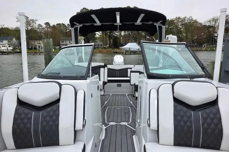 Slide: The Image of 2024 Monterey 275SS Super Sport boat interior with luxurious seating and sleek design. - 2