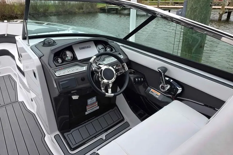 Slide: The Image of 2024 Monterey 275SS Super Sport boat cockpit with modern steering and controls. - 5