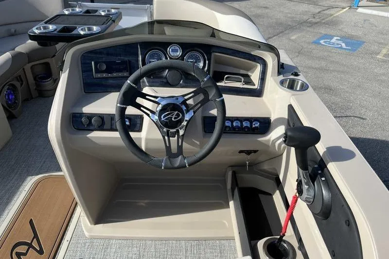 Slide: The Image of 2023 Avalon 2385 25 LSZ QL boat dashboard with steering wheel and controls. - 10