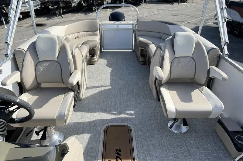 Slide: The Image of 2023 Avalon 2385 25 LSZ QL pontoon boat interior with plush seating and modern design. - 14