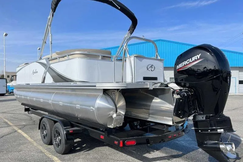 Slide: The Image of 2023 Avalon 2385 25 LSZ QL pontoon boat with Mercury outboard motor on trailer. - 3