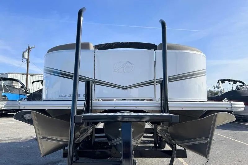 Slide: The Image of 2023 Avalon 2385 25 LSZ QL pontoon boat, front view, parked outdoors. - 5
