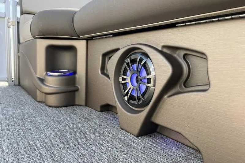 Slide: The Image of 2023 Avalon 2385 25 LSZ QL boat interior with speaker and cup holder. - 6