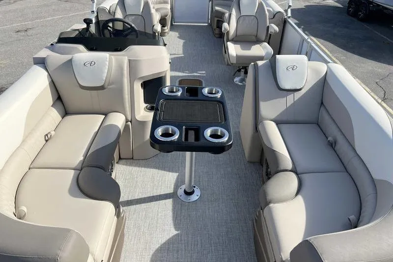 Slide: The Image of Luxurious 2023 Avalon 2385 25 LSZ QL pontoon boat interior with plush seating and cup holders. - 8