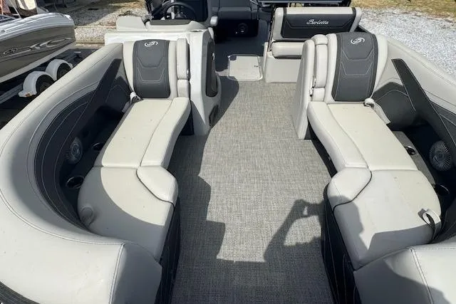 Slide: The Image of 2026 Barletta Cabrio 24UE pontoon boat interior with gray seating and carpeted floor. - 10